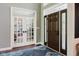 Inviting entryway with a decorative front door and a view of the office at 16307 Stony Ridge Dr, Noblesville, IN 46060