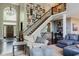 Inviting entryway with high ceilings, staircase, and stylish decor at 16307 Stony Ridge Dr, Noblesville, IN 46060