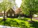 Charming brick home featuring a manicured lawn and mature shade trees at 16307 Stony Ridge Dr, Noblesville, IN 46060