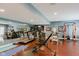 Well-equipped home gym with mirrored wall, exercise machines, and ample space for workouts at 16307 Stony Ridge Dr, Noblesville, IN 46060