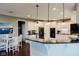 Kitchen featuring a breakfast bar, white cabinets, and stainless steel appliances at 16307 Stony Ridge Dr, Noblesville, IN 46060