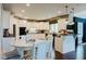 Bright kitchen showcasing white cabinets, granite countertops, and stainless steel appliances at 16307 Stony Ridge Dr, Noblesville, IN 46060