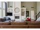 Cozy living room showcases built-in shelving, a fireplace, and comfortable seating at 16307 Stony Ridge Dr, Noblesville, IN 46060