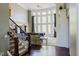 Bright living room boasts soaring windows, dark wood floors, and a cozy fireplace at 16307 Stony Ridge Dr, Noblesville, IN 46060