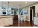 Open concept living space featuring a modern kitchen, dining area, and a comfortable living room with fireplace at 16307 Stony Ridge Dr, Noblesville, IN 46060