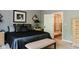 Cozy main bedroom with carpet and featuring a view into the ensuite bathroom and shower at 16307 Stony Ridge Dr, Noblesville, IN 46060