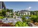Luxurious backyard with a pool, firepit, and fireplace provides an ideal space for outdoor enjoyment at 16310 Nightshore Ln, Fishers, IN 46037