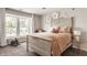 Cozy bedroom with large window, decorated with flower accents and rocking horse at 16310 Nightshore Ln, Fishers, IN 46037