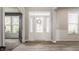 Bright foyer featuring a white front door with glass, hardwood floors, and plenty of natural light at 16310 Nightshore Ln, Fishers, IN 46037