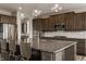 Spacious kitchen with granite countertops, stainless steel appliances, and an island with bar seating at 16310 Nightshore Ln, Fishers, IN 46037