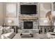 Comfortable living room with a stone fireplace, stylish decor, and a relaxing ambiance at 16310 Nightshore Ln, Fishers, IN 46037