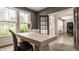 Stylish home office with a view of the front entrance through glass French doors at 16310 Nightshore Ln, Fishers, IN 46037