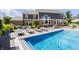 Inviting swimming pool with a clear view, set against a backdrop of manicured lawn and elegant landscaping at 16310 Nightshore Ln, Fishers, IN 46037