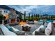 Inviting outdoor space featuring a pool, stone fireplace, and comfortable seating for relaxation and entertainment at 16310 Nightshore Ln, Fishers, IN 46037