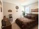 Comfortable bedroom with a decorative quilt, chair and wall decor at 17324 Americana Crossing Xing, Noblesville, IN 46060