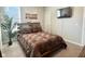 Bedroom features natural light, a neutral palette, and mounted television at 17324 Americana Crossing Xing, Noblesville, IN 46060