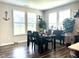 Formal dining room featuring hardwood floors and abundant natural light at 17324 Americana Crossing Xing, Noblesville, IN 46060