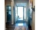 Bright foyer with hardwood floors and a front door with transom window at 17324 Americana Crossing Xing, Noblesville, IN 46060