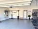 Spacious garage with epoxy flooring, wall storage and modern lighting at 17324 Americana Crossing Xing, Noblesville, IN 46060