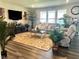 Cozy living room with a stone fireplace and comfortable furnishings at 17324 Americana Crossing Xing, Noblesville, IN 46060