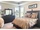 Comfortable main bedroom with a large bed, dresser, and serene decor creating a relaxing atmosphere at 17324 Americana Crossing Xing, Noblesville, IN 46060