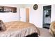 Cozy main bedroom with a comfortable bed and an en-suite bathroom visible through the open doorway at 17324 Americana Crossing Xing, Noblesville, IN 46060