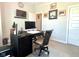 Home office boasts natural light, a mounted television and dark colored desk at 17324 Americana Crossing Xing, Noblesville, IN 46060