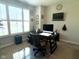 Bright home office with built-in shelving, a large window and mounted television at 17324 Americana Crossing Xing, Noblesville, IN 46060