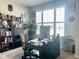 Bright home office with built-in shelving and a large window with plantation shutters at 17324 Americana Crossing Xing, Noblesville, IN 46060