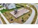 Overhead view of a neighborhood playground, landscaped with trees and a walking path beside a residential house at 17324 Americana Xing, Noblesville, IN 46060