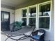 Relaxing covered porch with a comfortable hammock and stylish outdoor seating at 17324 Americana Xing, Noblesville, IN 46060