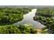 Breathtaking aerial view of a lake community with a pristine pool area surrounded by lush forests and waterfront homes at 2034 Dynasty Ridge Rd, Martinsville, IN 46151