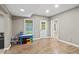 Finished basement featuring wood-look flooring, a bright window, and access to the outside at 2034 Dynasty Ridge Rd, Martinsville, IN 46151