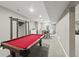 Finished basement with a pool table, wet bar, and sliding barn doors at 2034 Dynasty Ridge Rd, Martinsville, IN 46151