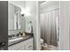 An efficient bathroom featuring a granite sink, brushed nickel hardware, and a tiled shower at 2034 Dynasty Ridge Rd, Martinsville, IN 46151