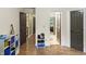 Bedroom with wood floors and neutral paint, with multiple doors and an organizer at 2034 Dynasty Ridge Rd, Martinsville, IN 46151
