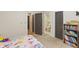 Bright and airy bedroom with neutral paint and soft carpet. Multiple doors lead to different areas of the house at 2034 Dynasty Ridge Rd, Martinsville, IN 46151
