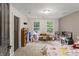 Playroom featuring plush carpet, neutral paint, and two windows providing plenty of natural light at 2034 Dynasty Ridge Rd, Martinsville, IN 46151