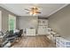 Neutral bonus room complete with ceiling fan, laminate flooring, and lots of open floor space at 2034 Dynasty Ridge Rd, Martinsville, IN 46151