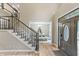 Grand foyer featuring a staircase, high ceilings, and view into the dining room with natural light at 2034 Dynasty Ridge Rd, Martinsville, IN 46151