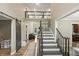 Inviting foyer featuring a grand staircase, high ceilings, and seamless access to living areas at 2034 Dynasty Ridge Rd, Martinsville, IN 46151