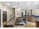 Modern kitchen with island, countertop gas range, and seating at 2034 Dynasty Ridge Rd, Martinsville, IN 46151