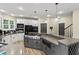 Spacious eat-in kitchen features a large island and modern appliances at 2034 Dynasty Ridge Rd, Martinsville, IN 46151