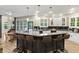 Bright, eat-in kitchen with breakfast bar seating, ample counter space, and a view to the backyard at 2034 Dynasty Ridge Rd, Martinsville, IN 46151