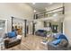 Open living room with hardwood floors, neutral color palette, fireplace, stairs, and second floor loft at 2034 Dynasty Ridge Rd, Martinsville, IN 46151