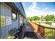 Charming outdoor patio with lake views, bench seating, and lovely flowers at 2034 Dynasty Ridge Rd, Martinsville, IN 46151