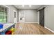 Finished basement playroom with wood flooring, natural light and a view to the exterior at 2034 Dynasty Ridge Rd, Martinsville, IN 46151