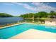 Beautiful community pool with lake view, lounge chairs and meticulously maintained deck at 2034 Dynasty Ridge Rd, Martinsville, IN 46151