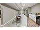 Finished basement featuring a wet bar with seating, modern lighting, and ample countertop space at 2034 Dynasty Ridge Rd, Martinsville, IN 46151