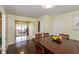 Open dining room with hardwood floors, a view of the entryway, and lots of natural light at 2170 N Old State Road 9, Columbus, IN 47203